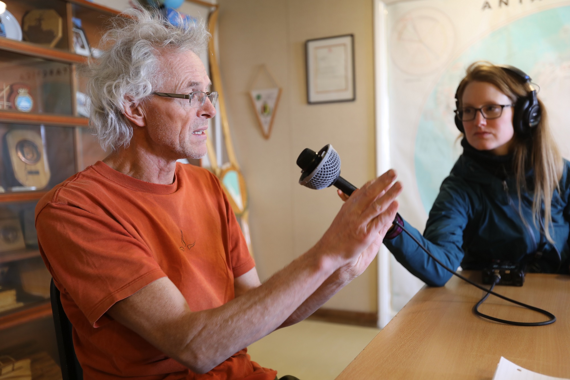 Researcher Andy Smith speaks with journalist Carolyn Beeler at Rothera Station. Photo credit: Linda Welzenbach