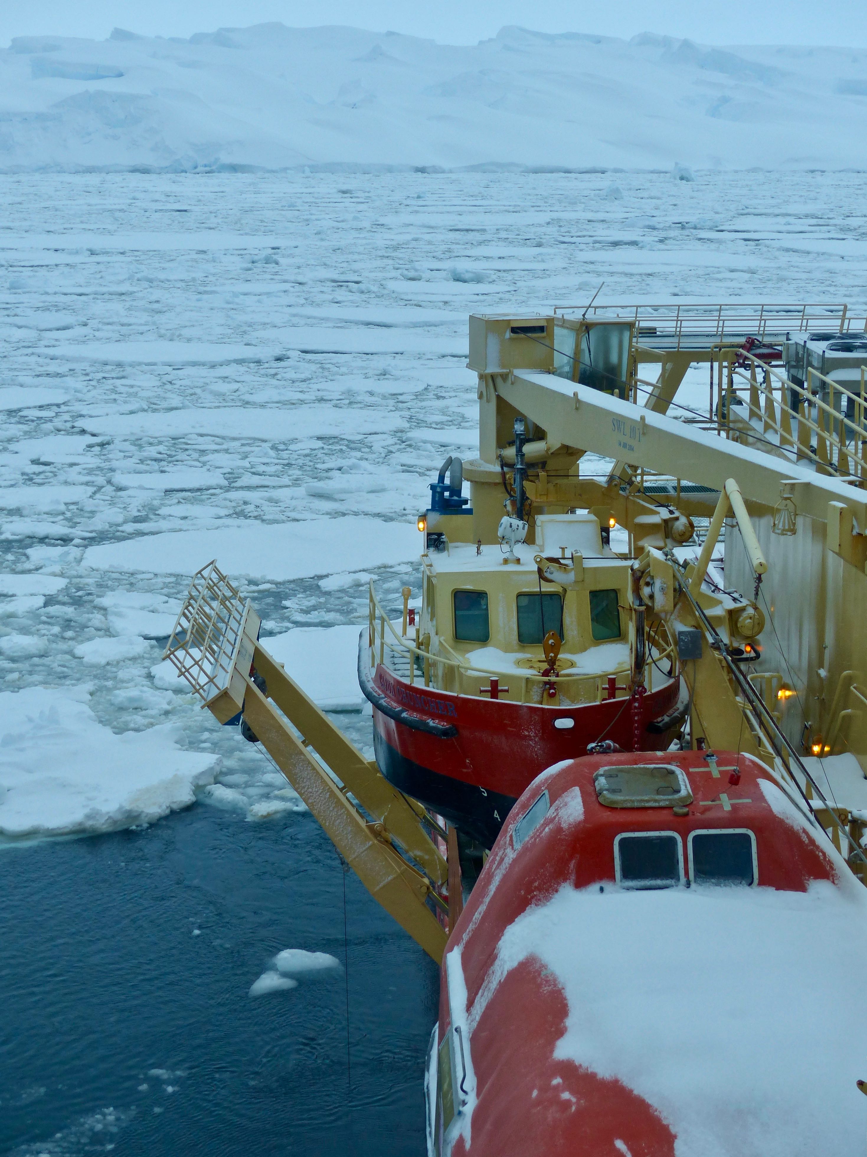 The Palmer sits a short distance from a giant iceberg and Thwaites ice shelf within sea ice that has moved here in the last few hours, beginning the ship's retrieval of the Hugin. Photo credit: Tasha Snow