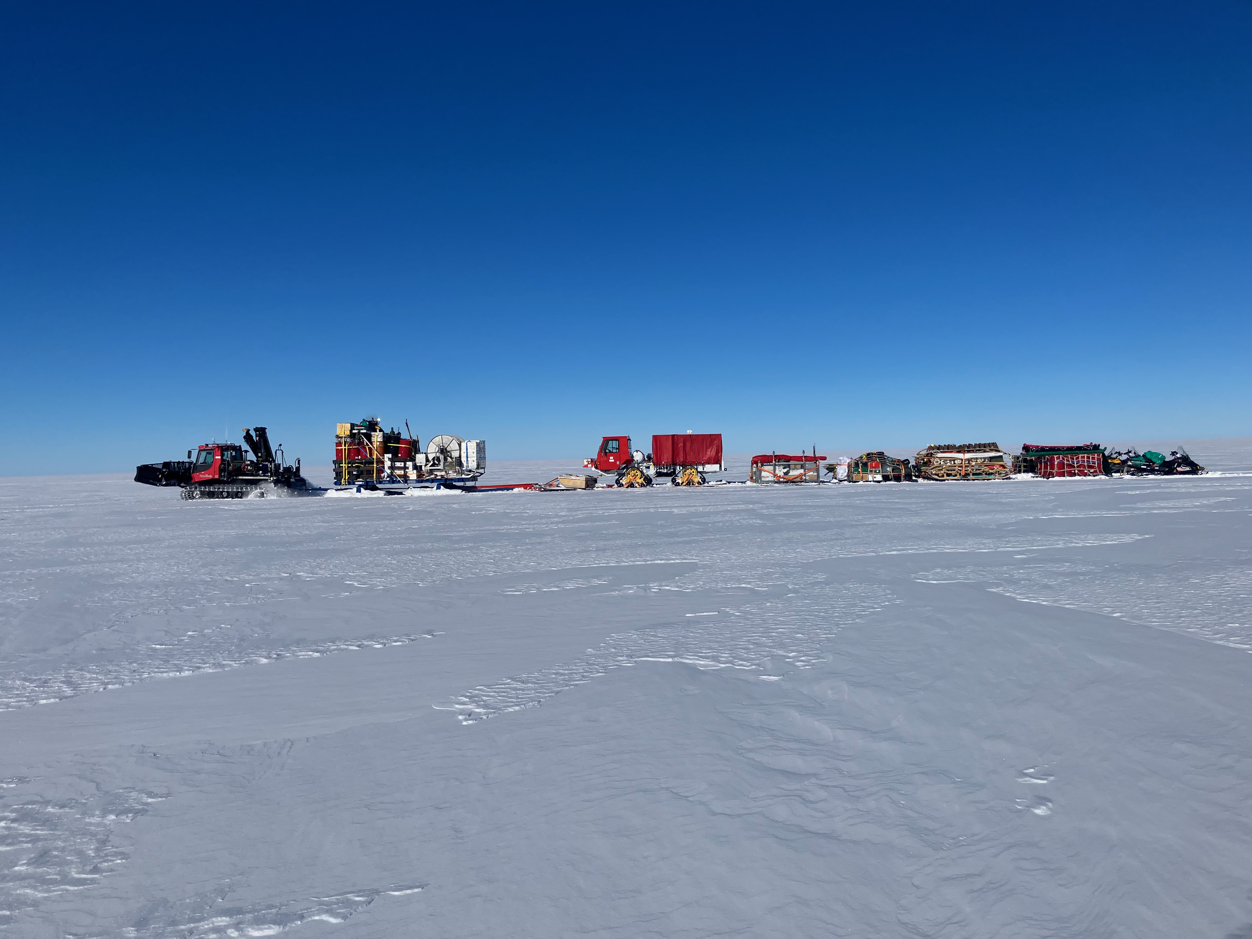 Line of equipment in the traverse across Thwaites Glacier. Photo credit Olaf Eisen