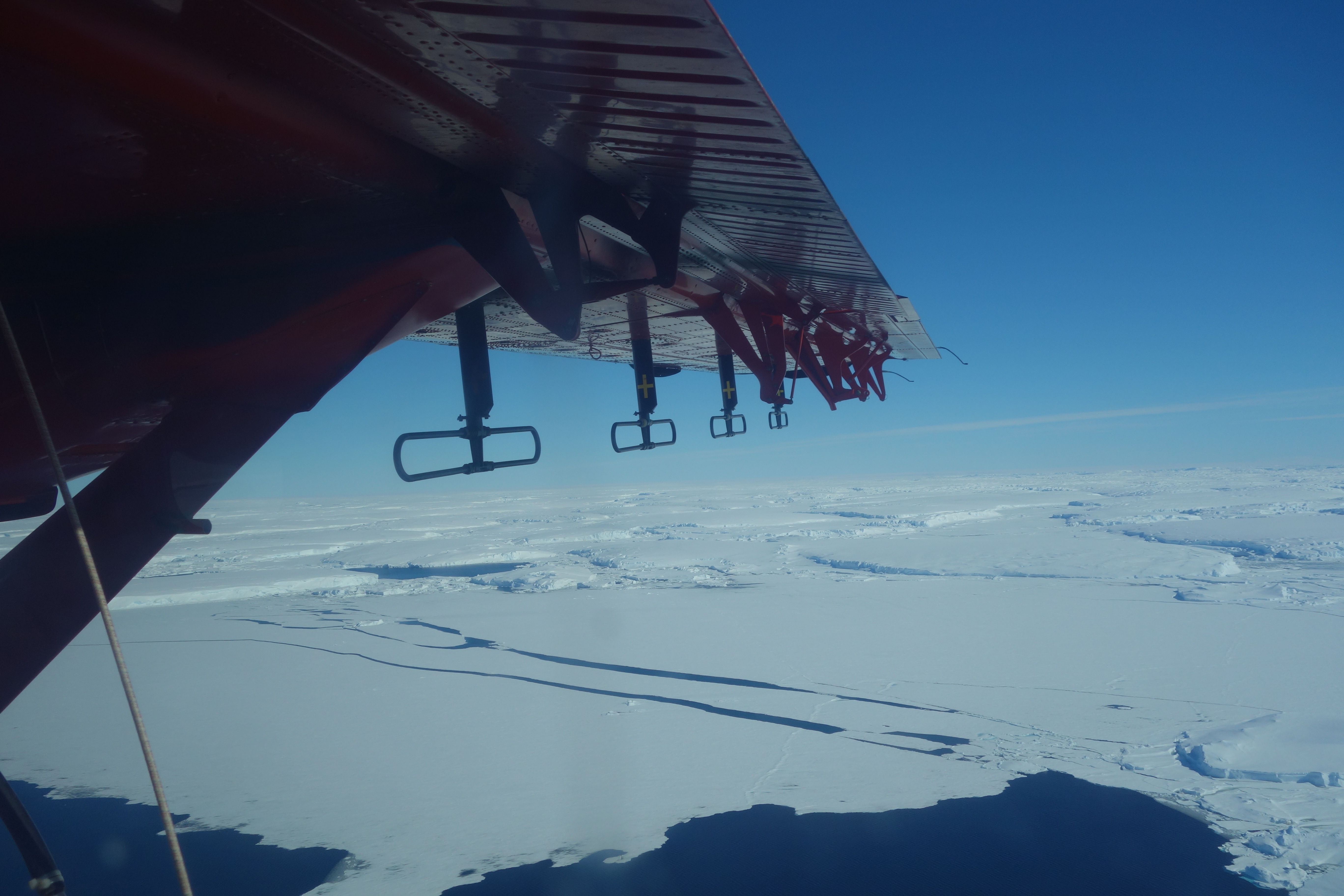 A plane wing over ice