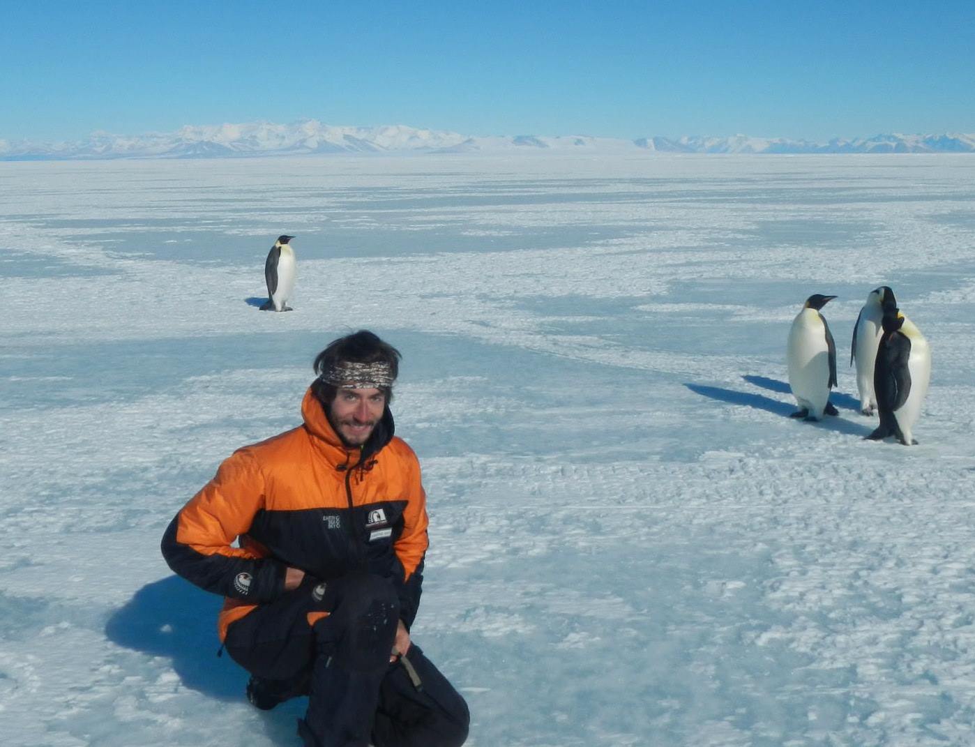 Christian Wild with Emperor penguin