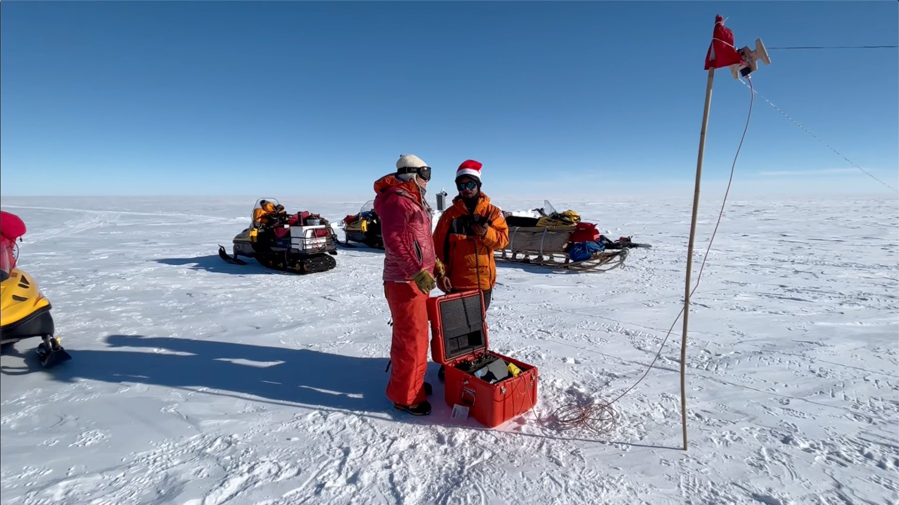 Figure 5a: Kirah and TJ singing Silent Night over the HF Radio during Antarctic HF Radio Christmas caroling. 