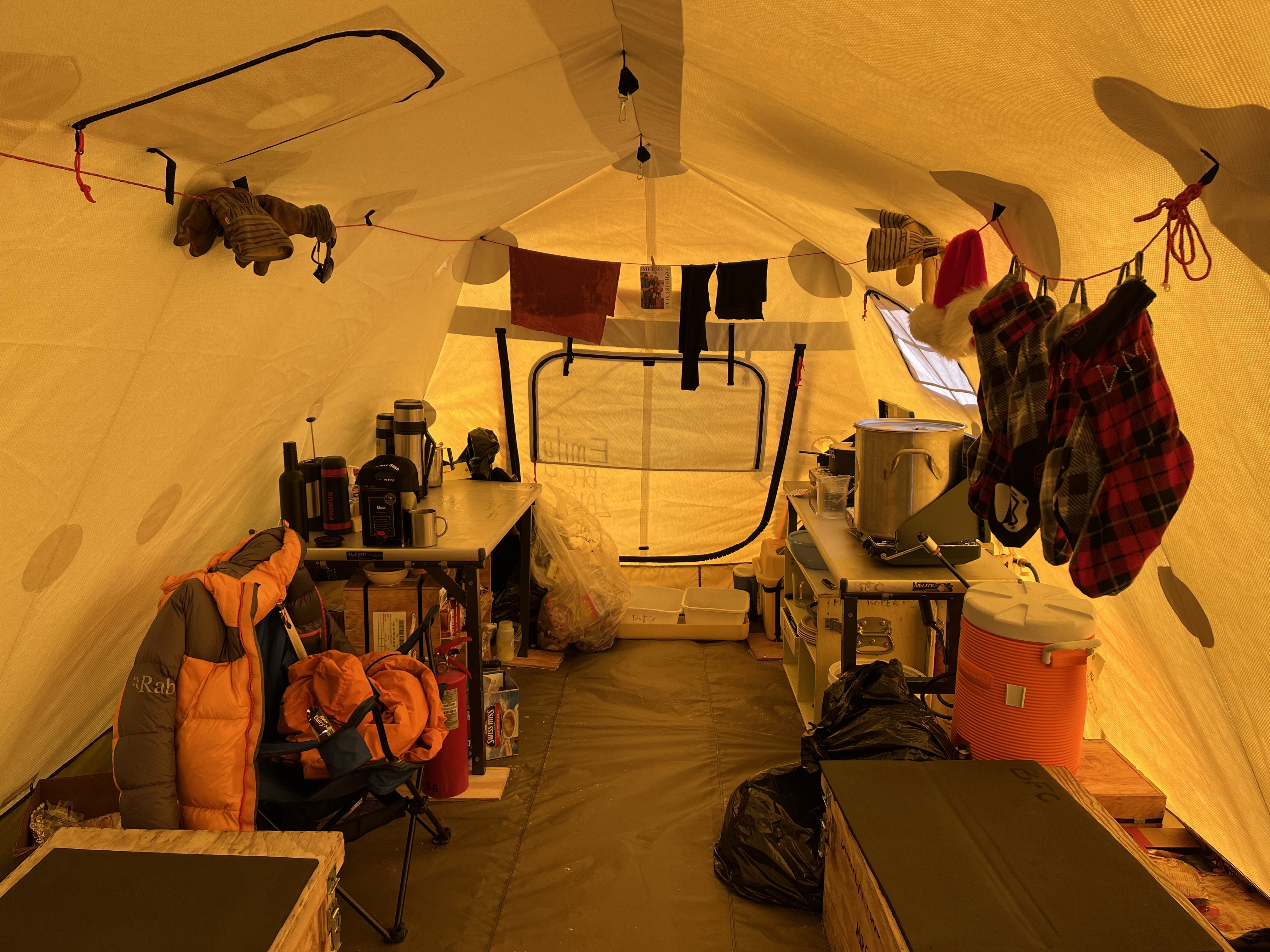 Figure 5b: Six TIME Team stockings, handmade by Paul in McMurdo, hanging in our cook tent on Christmas Eve. Photo by Marianne Karplus.