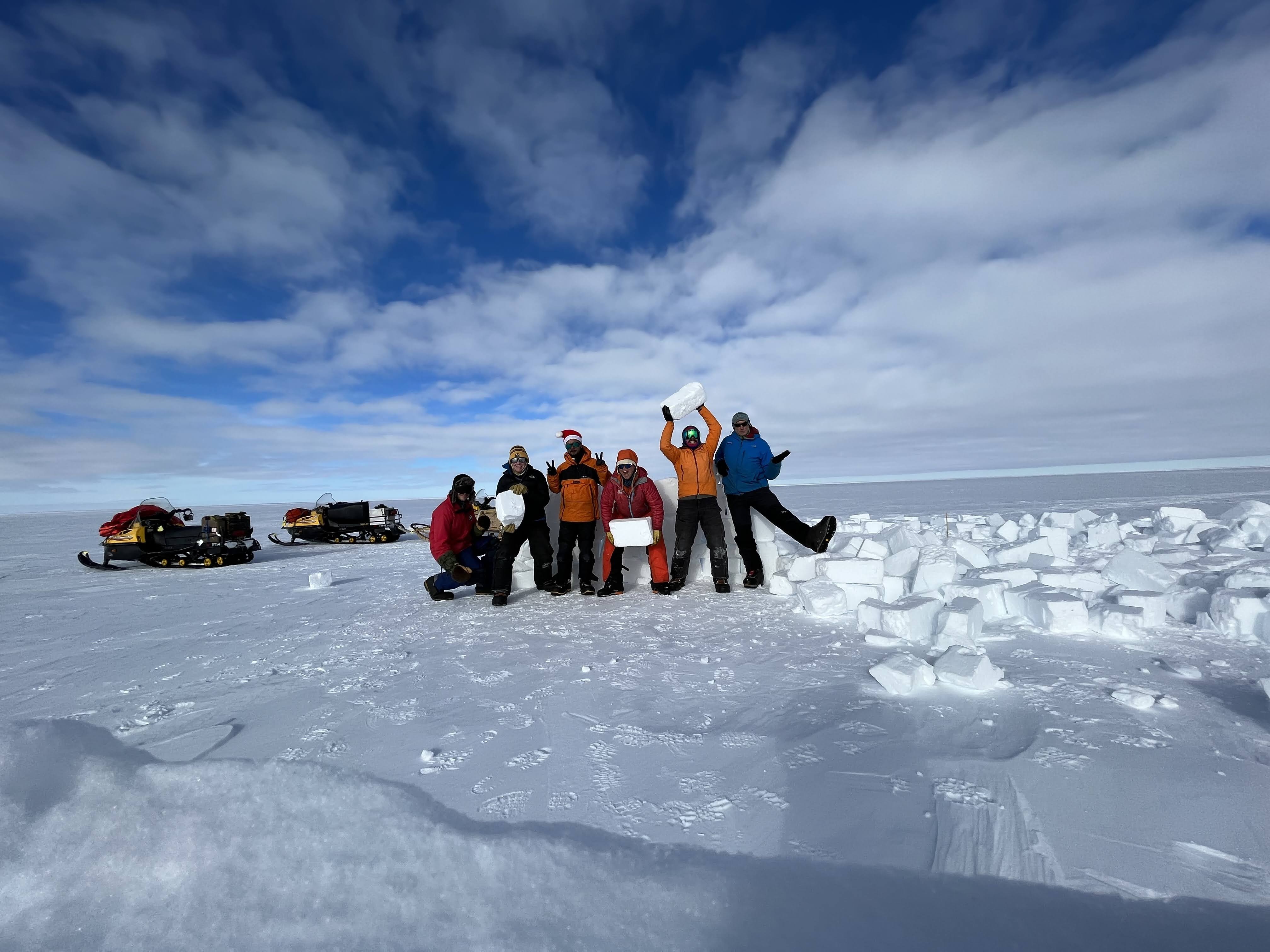 Figure 9. TIME USAP Team digging up a seismometer on Christmas Day.