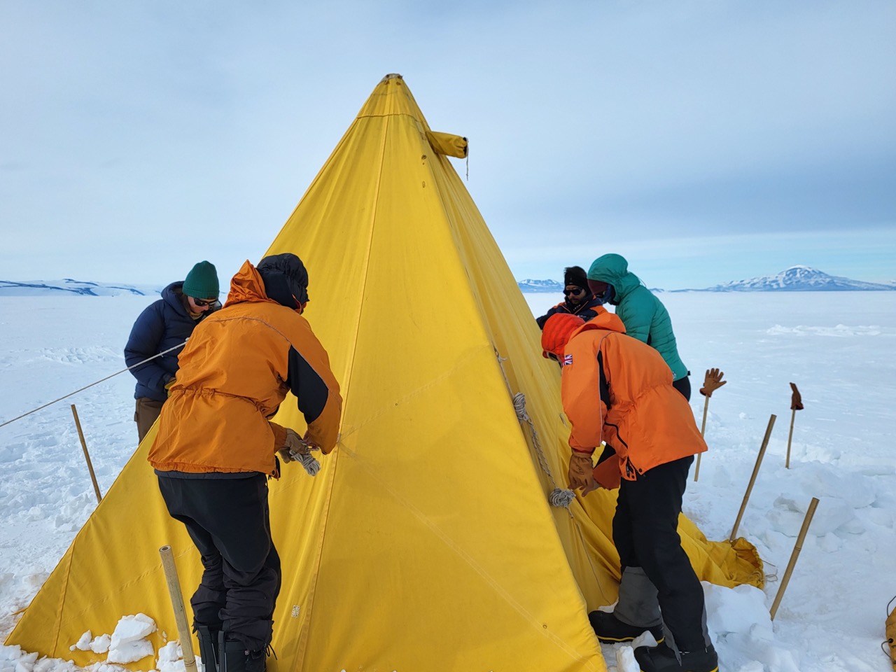 The TIME field team practices securing a tent near McMurdo.