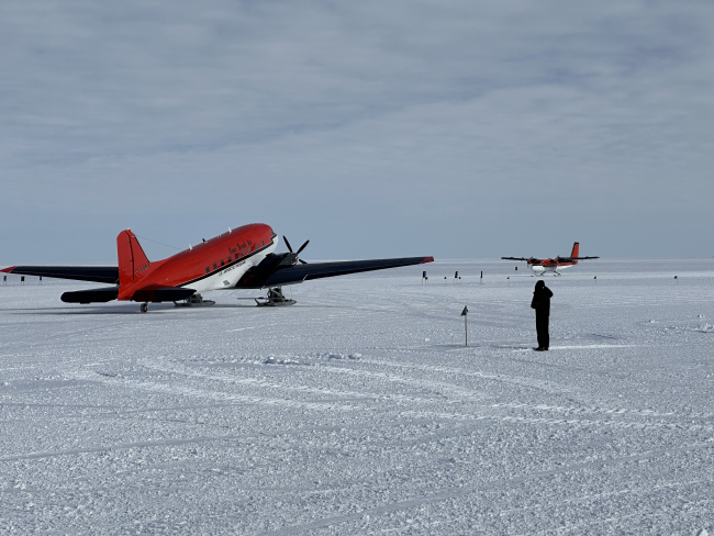 Planes sit near the runway at the WAIS Divide camp. Photo credit: Marianne Karplus