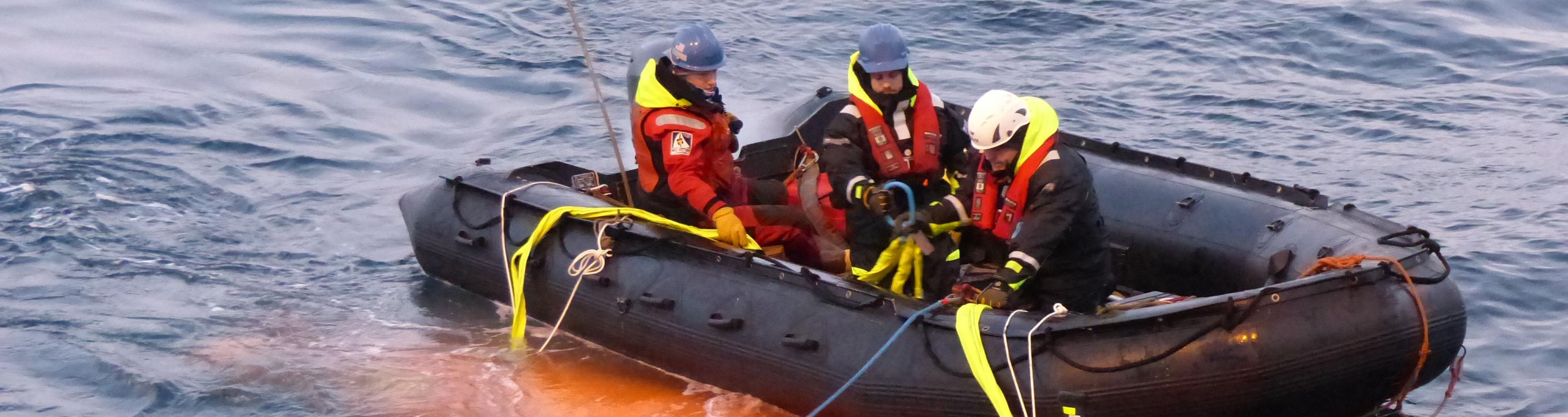After the Hugin's first test in Antarctica, Jennie Mowatt, Filip Stedt, and Jonas Andersson (from left to right) have just wrangled the Hugin into its harness and now tow it over to the Palmer to be retrieved by the crane. Photo credit: Tasha Snow